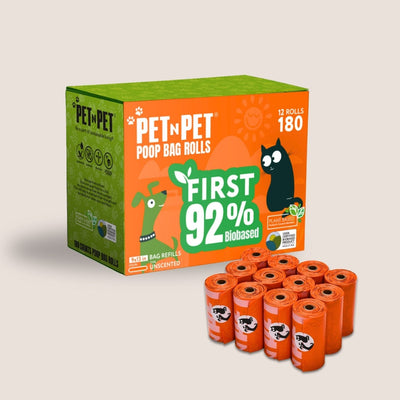 Box of Pet-N-Pet poop bag rolls with multiple bags on a light gray background