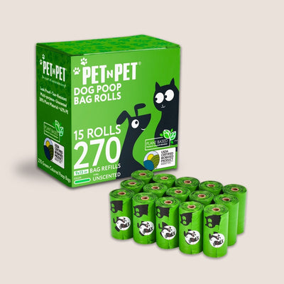 Green packaging of Pet 'N Pet dog poop bag rolls with multiple bags displayed in front.